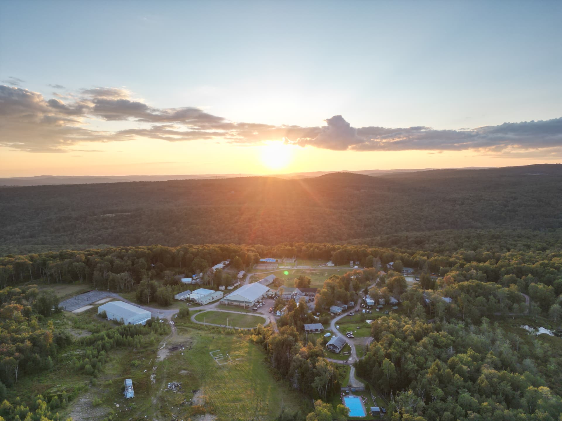 Camp concert stage at dusk